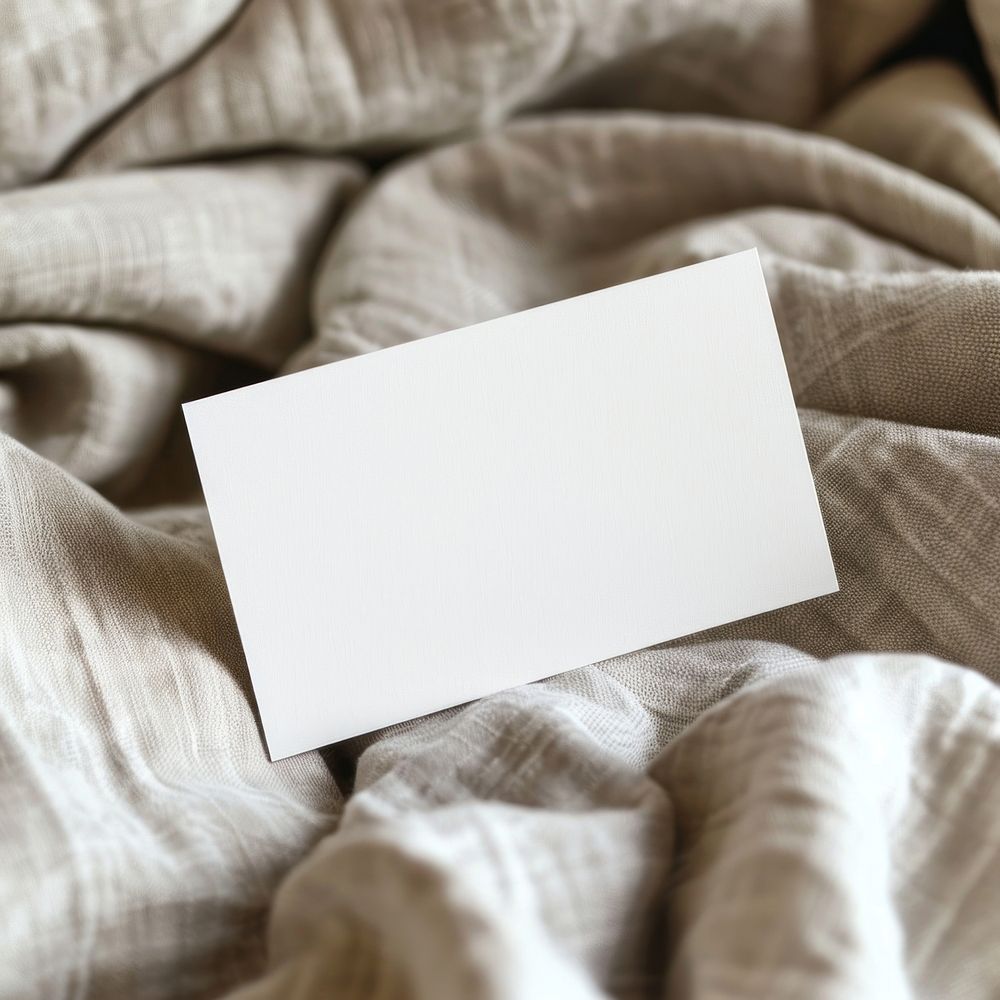 Blank white business card mockup cushion blanket pillow.