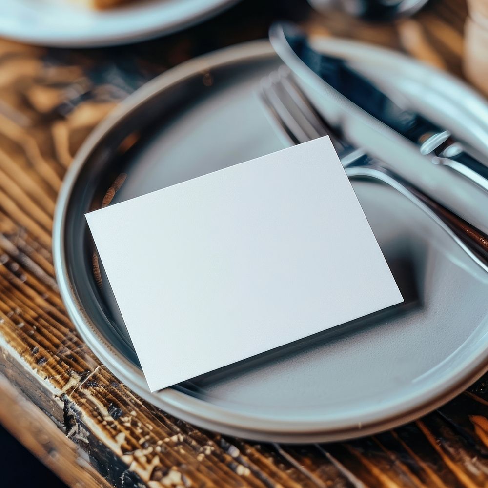Blank white business card mockup cutlery plate food.