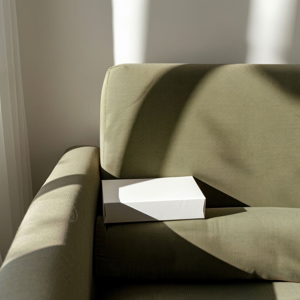 Blank bakery box packaging mockup armchair furniture couch.