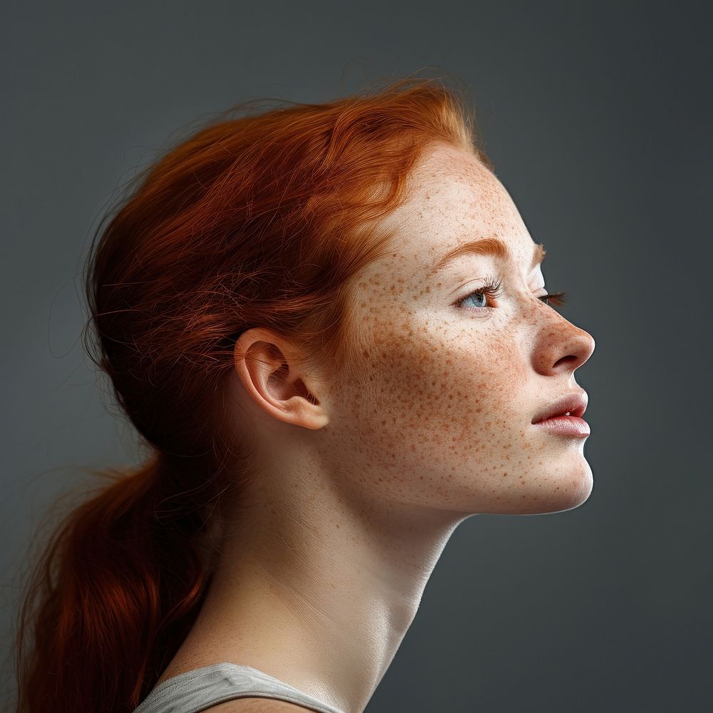 Freckles girl side portrait profile adult photo contemplation.