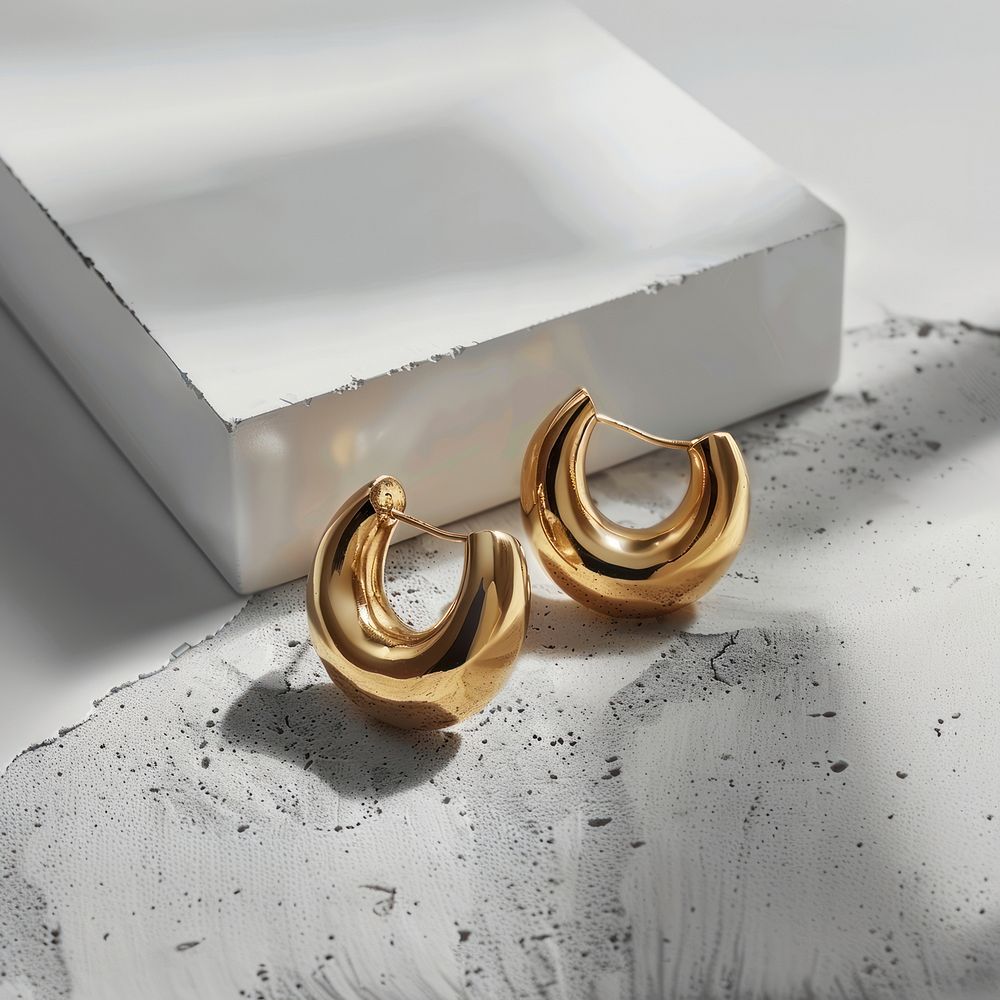 Gold hoop earrings text accessories accessory.