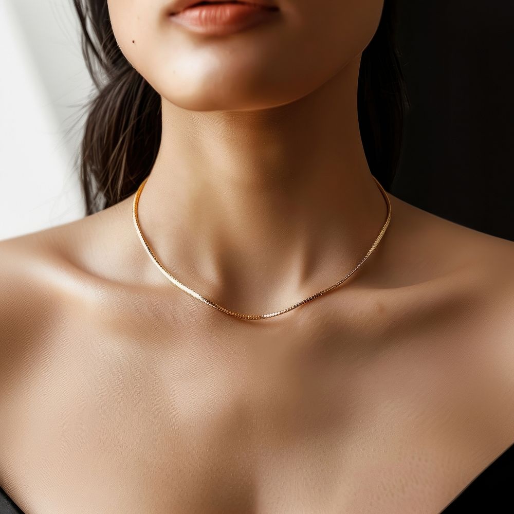 A gold necklace accessories accessory shoulder.
