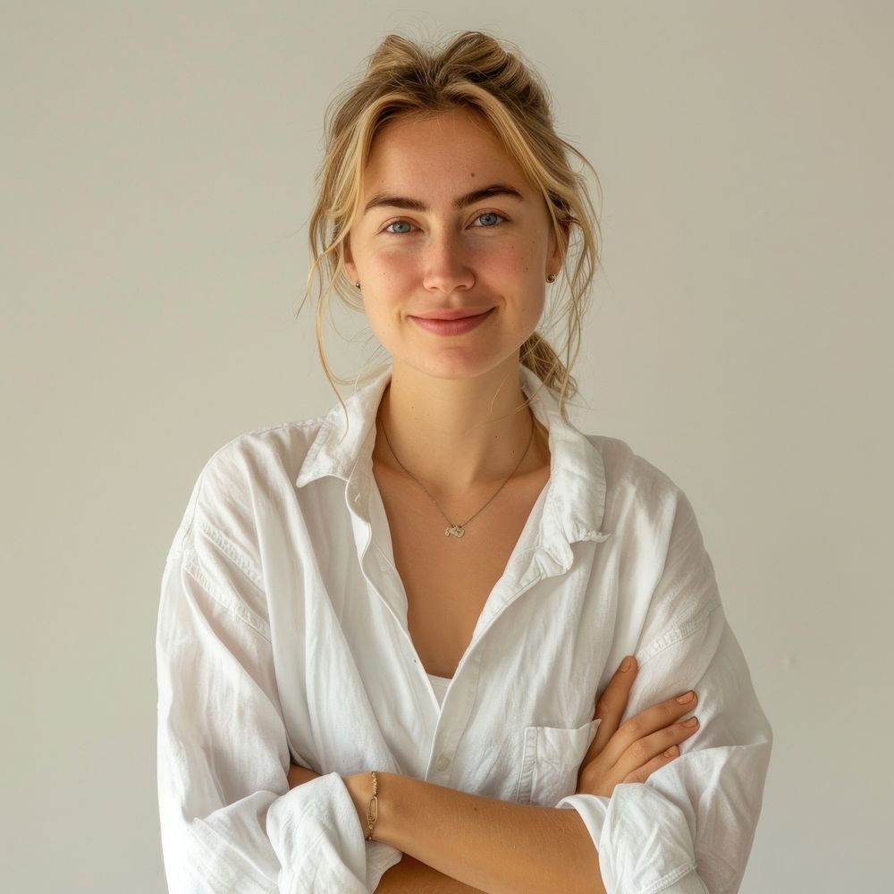 Confident woman in white shirt