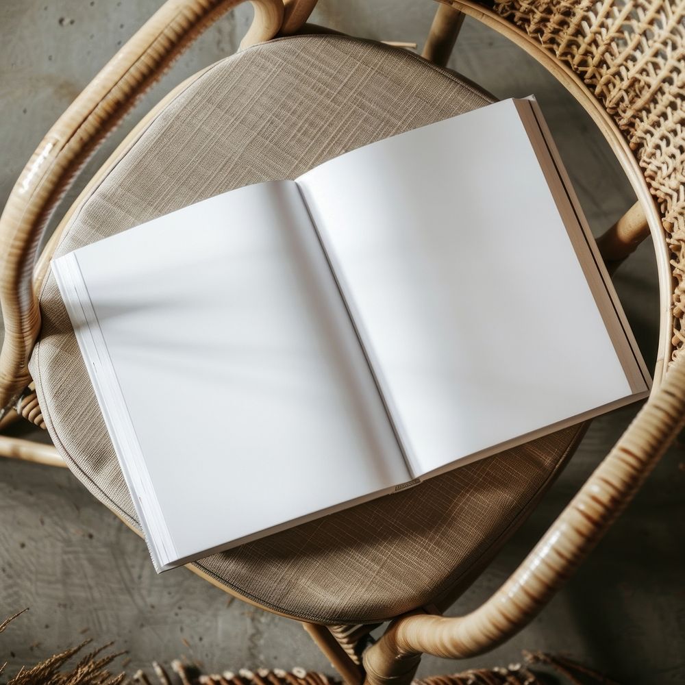 Open blank book on chair