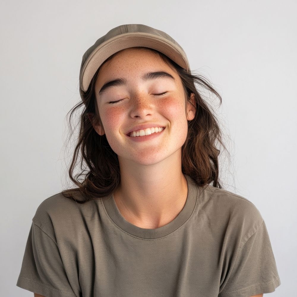 Young woman with a lively smile cap expression.