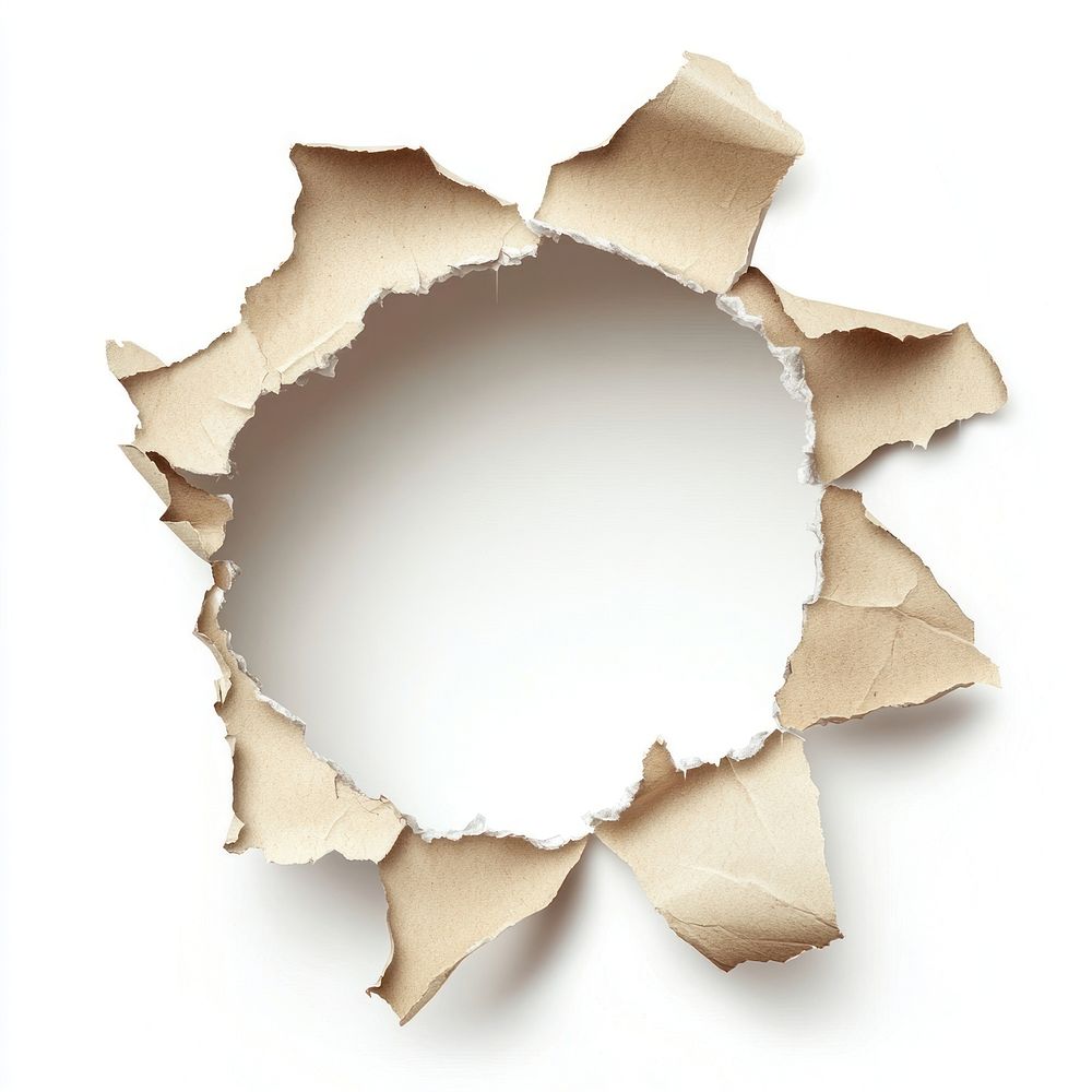 Ragged hole torn in ripped paper background isolated white.