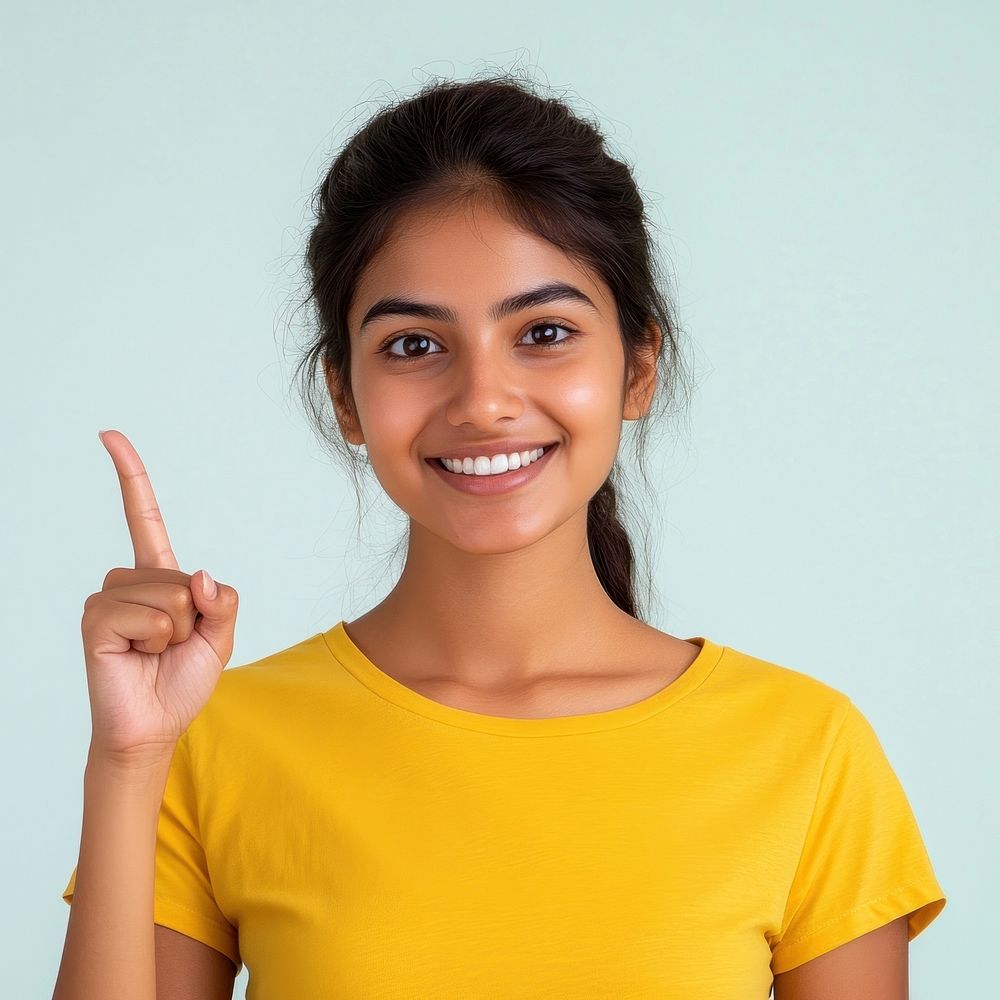 Indian woman wearing a yellow t-shirt happy background expression.