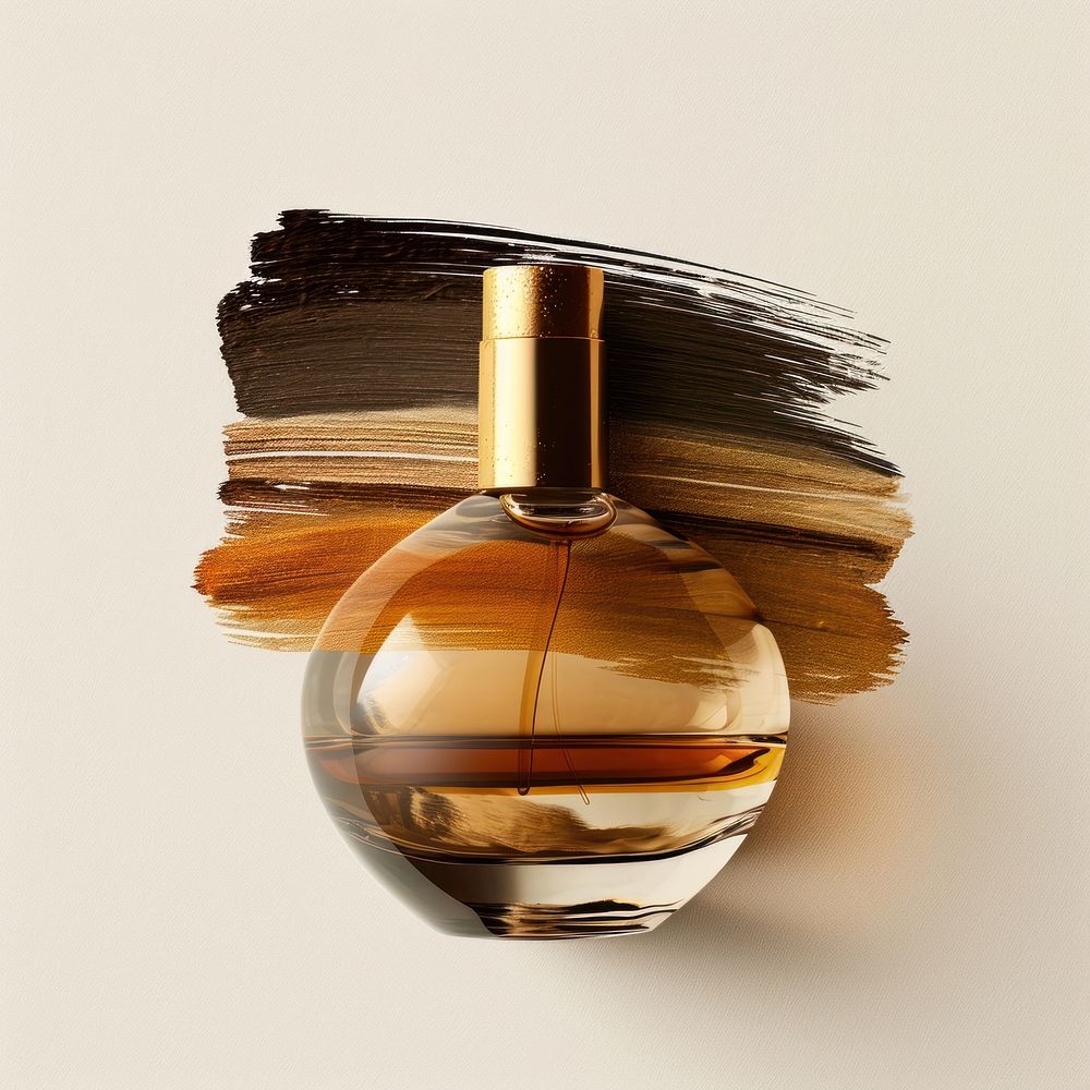 A perfume bottle with a brown and gold brush stroke cosmetics lighting circle.