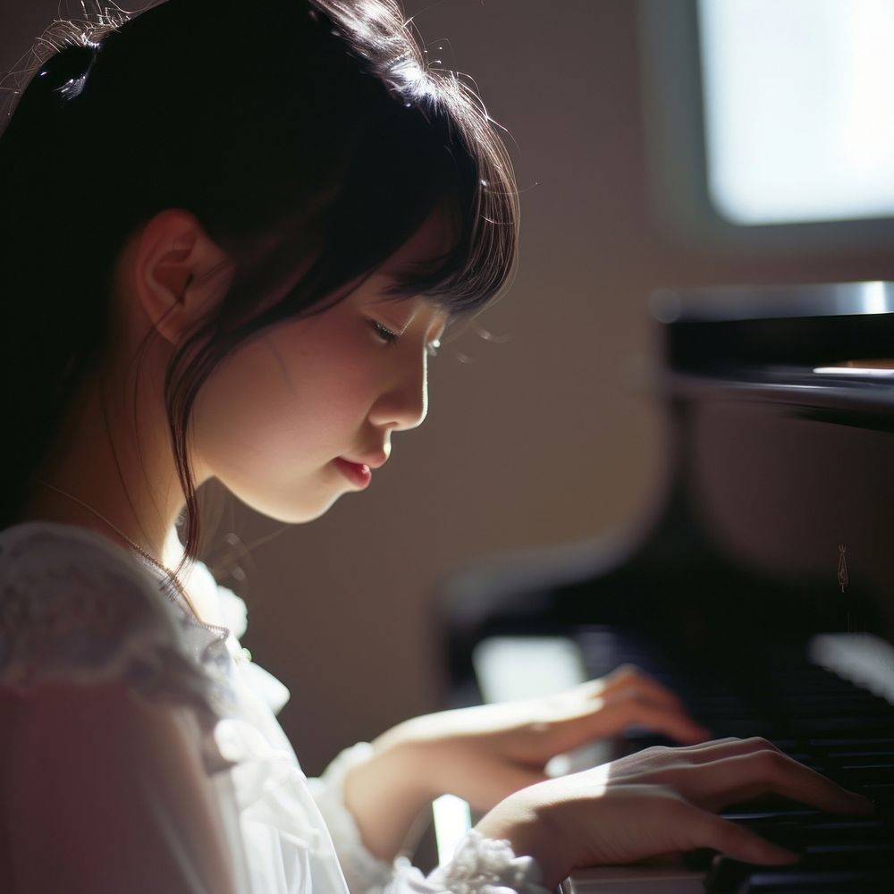 Japanese high school woman piano keyboard musician.