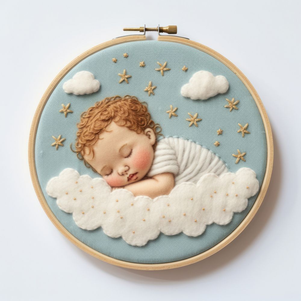 A sleeping baby embroidery representation cross-stitch.