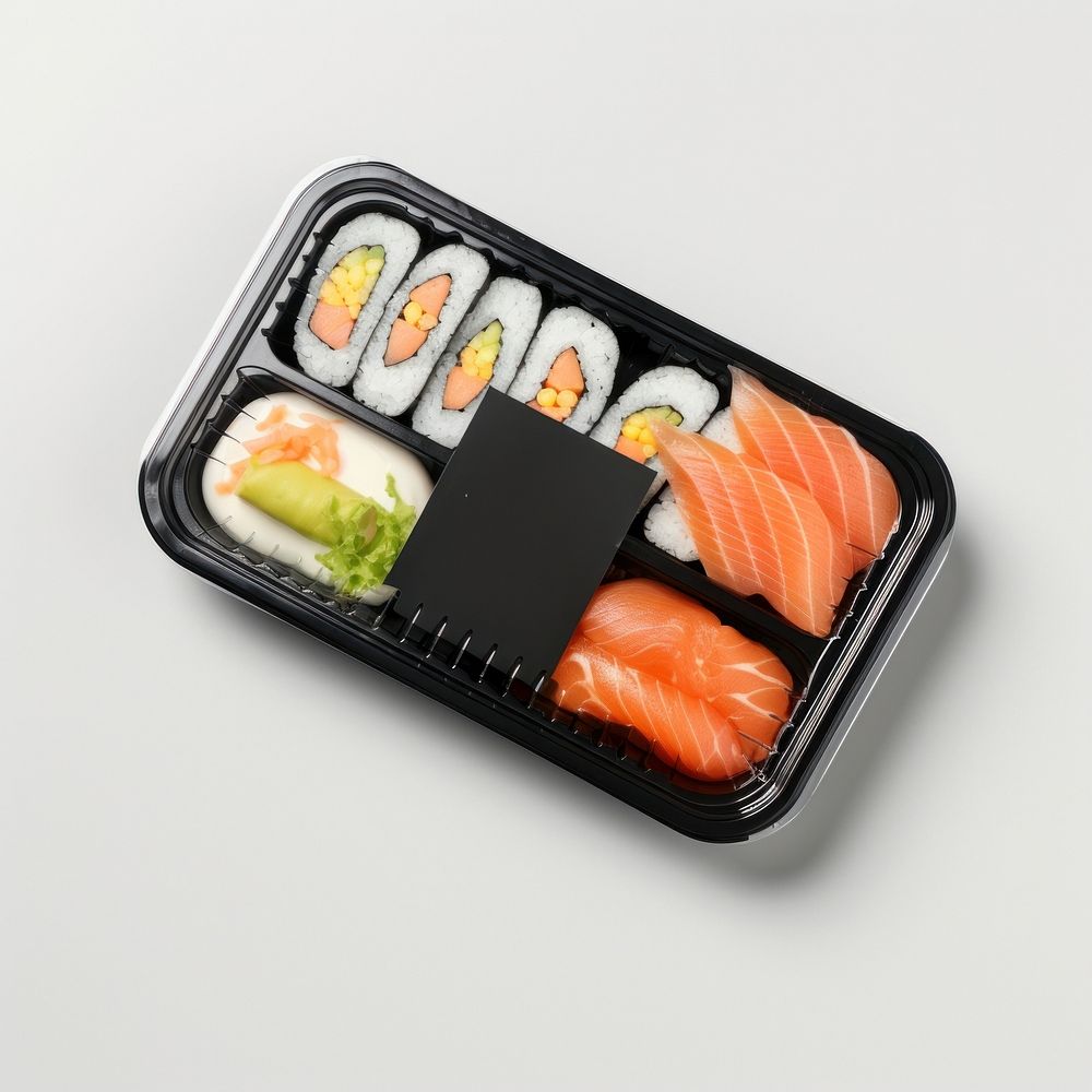 Sealable black plastic tray and cover with sushi and blank label  packaging lunch rice food.