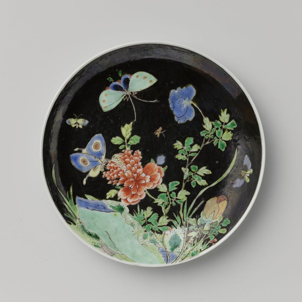 Saucer with butterflies and flowering plant near a rock (c. 1700 - c. 1724) by anonymous