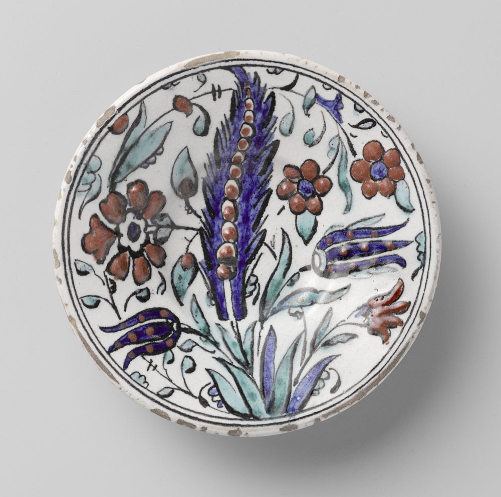 Plate with a stylized flowering plant (c. 1540 - c. 1560) by anonymous