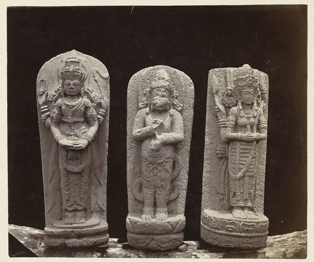 Three steles; Hanuman (middle) and two deification images, the left showing features of Parvati, the right of Lakshmi…