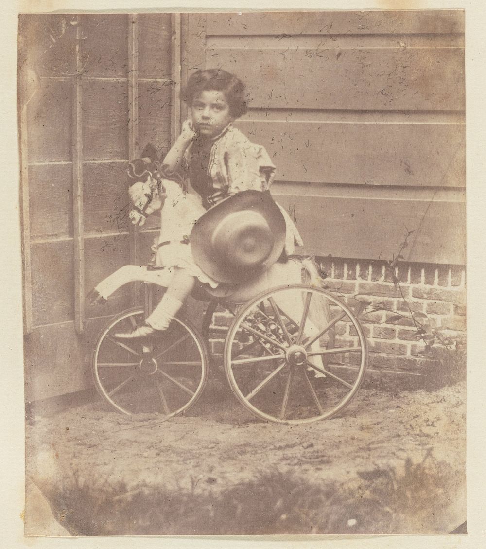 Lodewijk Asser, zoon van de fotograaf, op een driewieler (c. 1853) by Eduard Isaac Asser