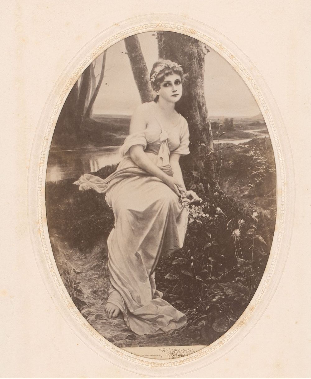Fotoreproductie van een schilderij van een vrouw met bloemen in haar haren, zittend aan de waterkant (1860 - 1890) by…