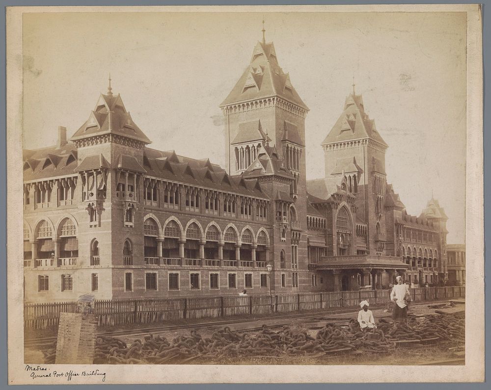 Two men in front of the General Post Office building at Chennai (Madras), Tamil Nadu, India (1884 - 1885) by Nicholas and Co