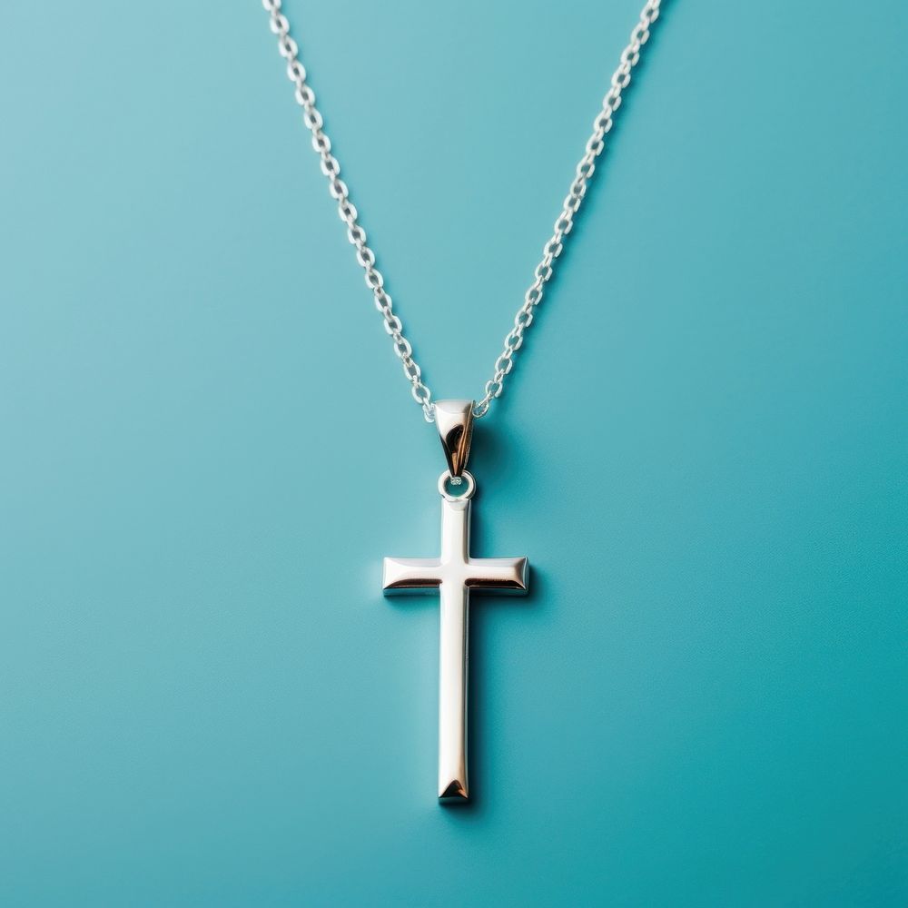 A silver Christ Cross necklace cross pendant jewelry. AI generated Image by rawpixel.