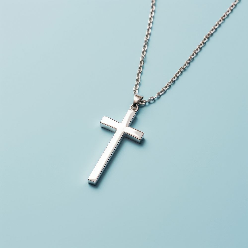 A silver Christ Cross necklace cross pendant jewelry. AI generated Image by rawpixel.