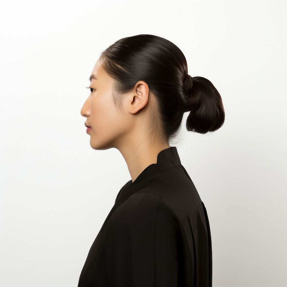 An east asian woman ponytail adult contemplation.