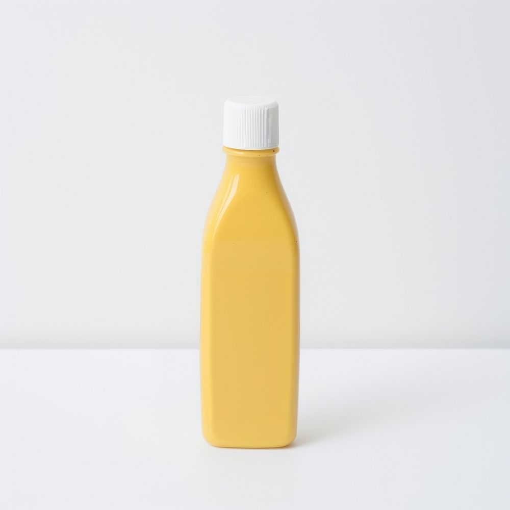 Mustard sauce plastic squeeze bottle with blank white label juice white background refreshment.