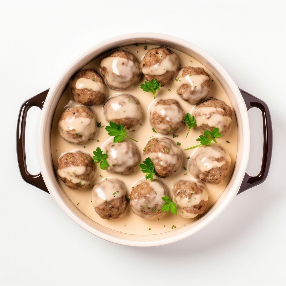 Swedish meatballs in a beige hot dish ceramic food meal white background.