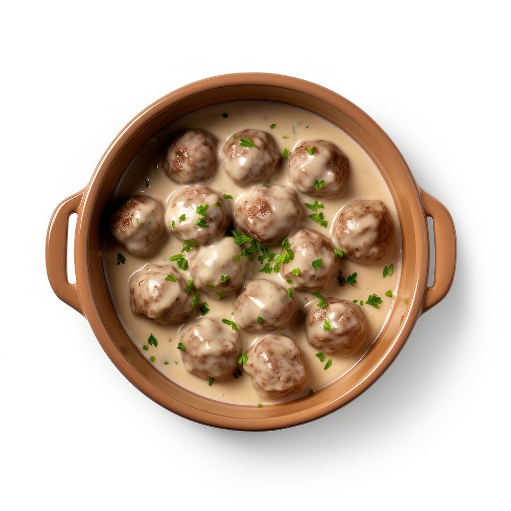 Swedish meatballs in a beige hot dish ceramic food meal bowl.