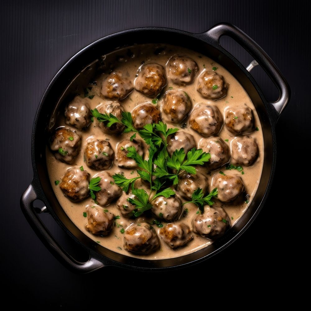 Swedish meatballs in a retro black dutch oven pot food meal vegetable.