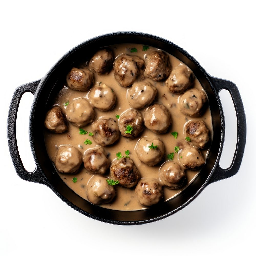 Swedish meatballs in a retro black dutch oven pot food plate meal.
