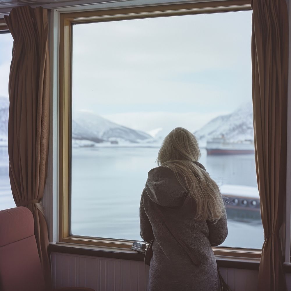 Woman on a cruise ship nature winter window.