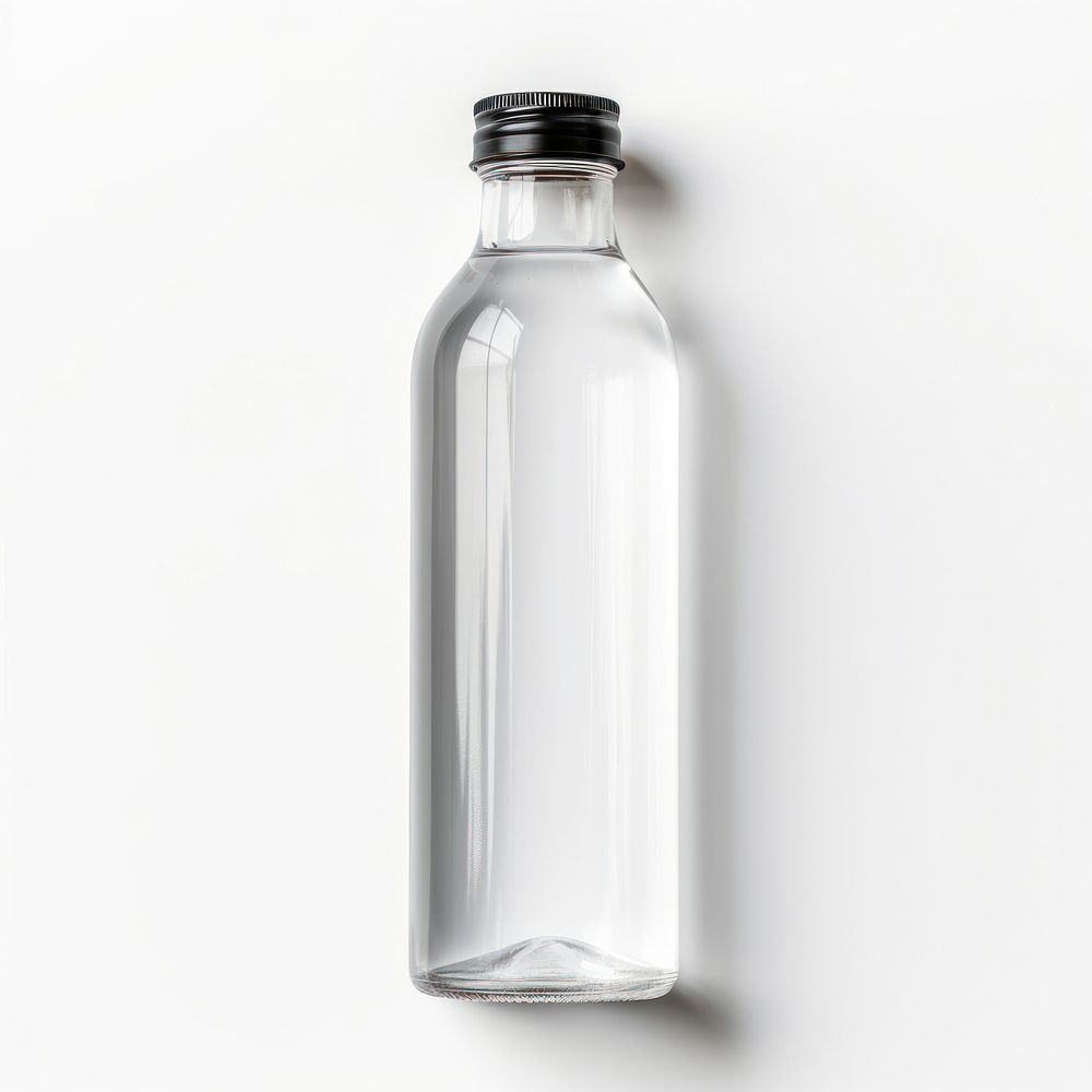 Transparent plastic bottle with label  glass white background refreshment.
