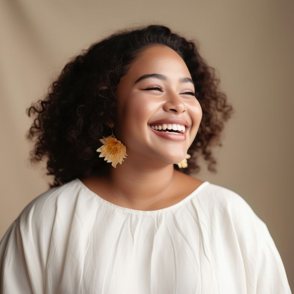 A chubby Micronesian woman in happy mood laughing portrait smile.