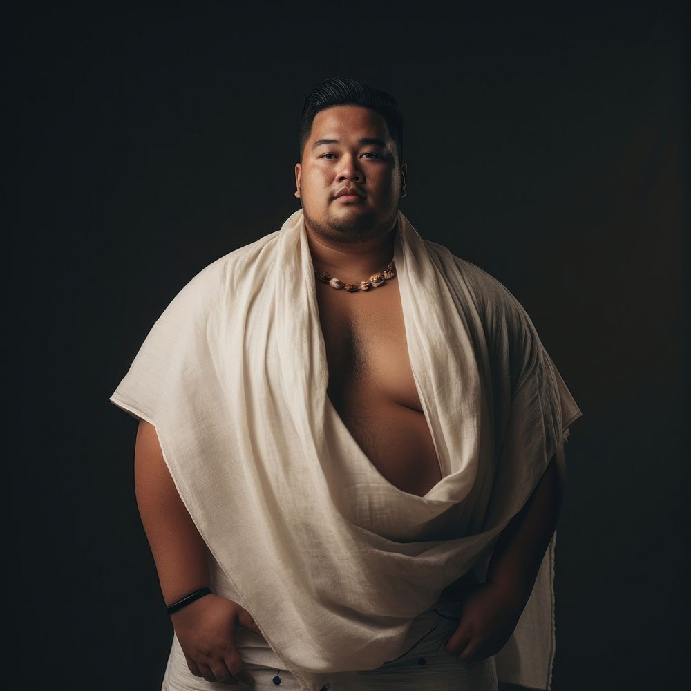 A chubby Pacific Islander male in traditional cloth portrait adult photo.