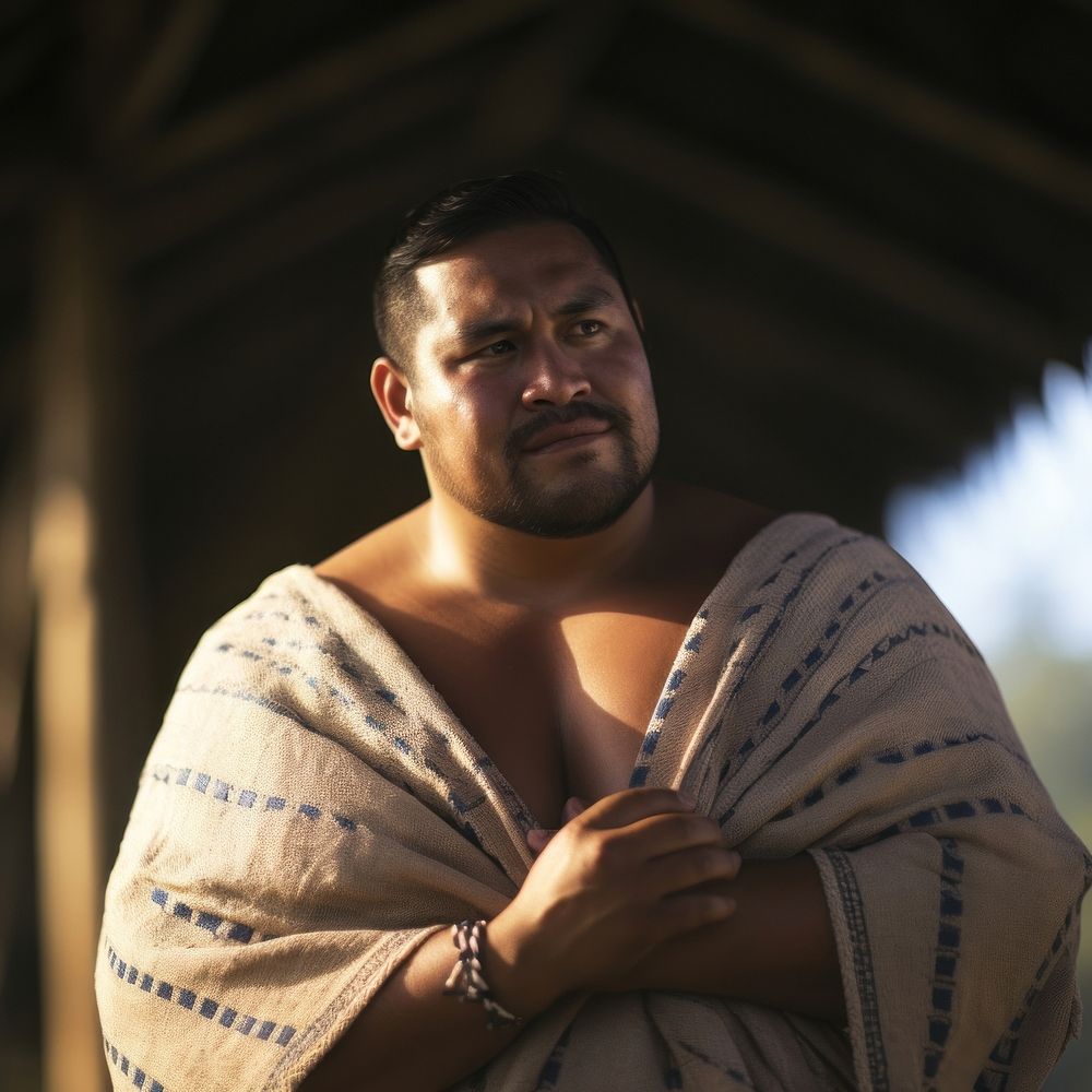 A chubby Tonga male in traditional cloth portrait adult photo.