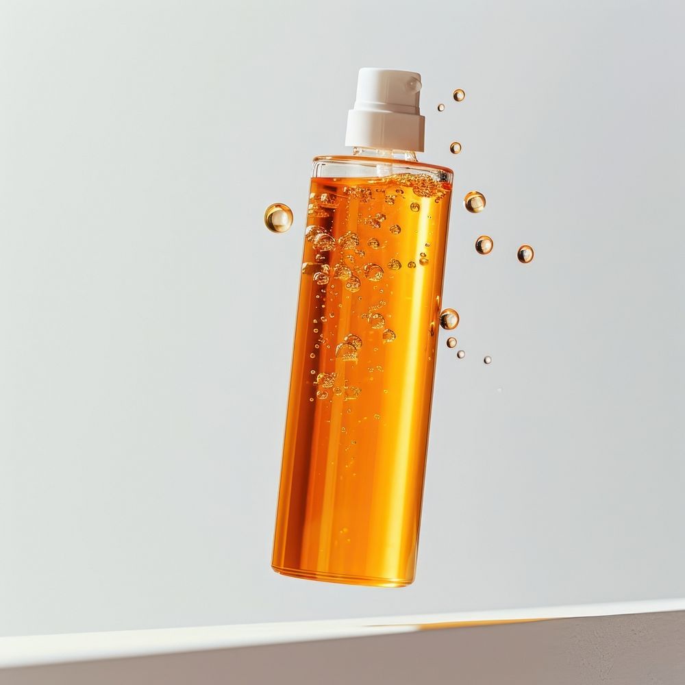 Orange clear showergel bottle perfume refreshment laboratory.