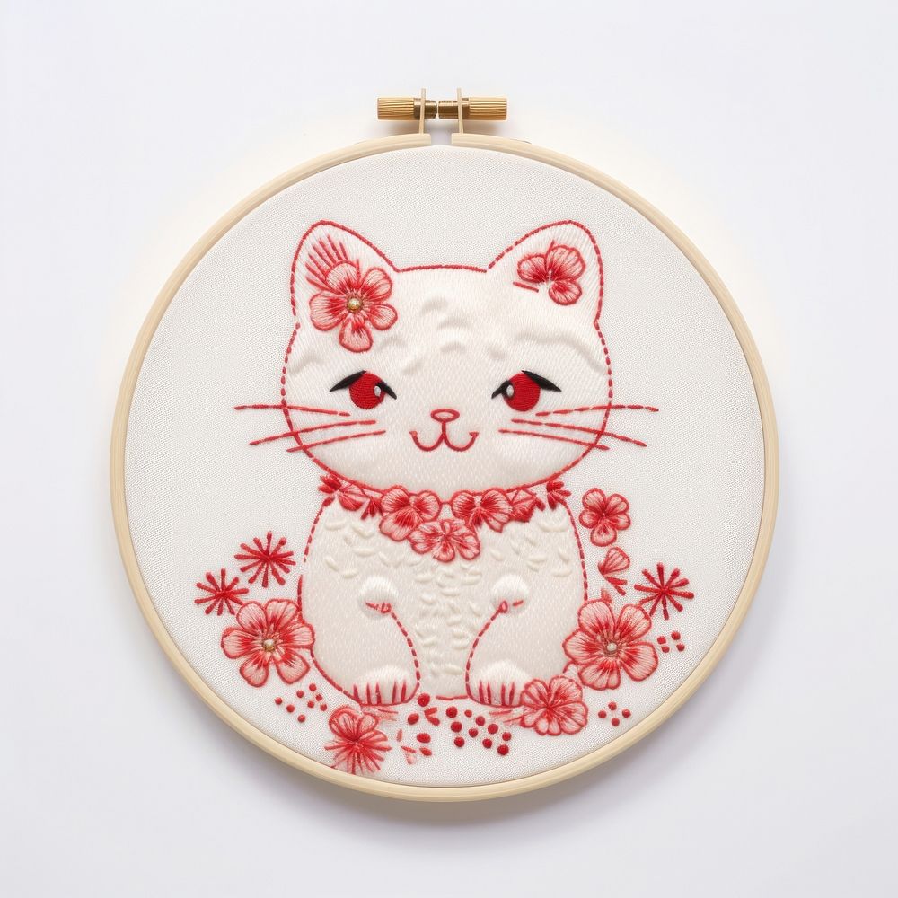 Maneki neko in embroidery style needlework pattern textile.