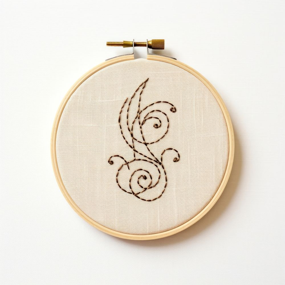 Music in embroidery style pattern textile pendant.