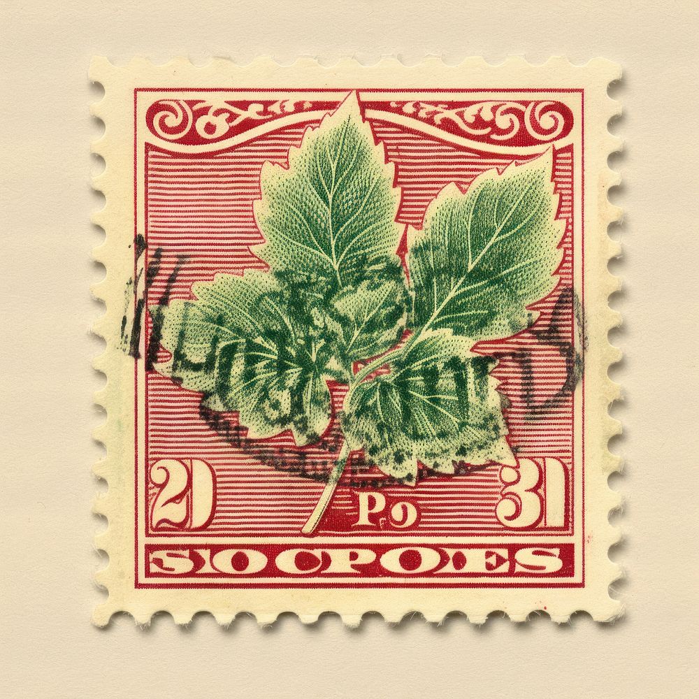 Vintage postage stamp with leaf plant needlework embroidery.