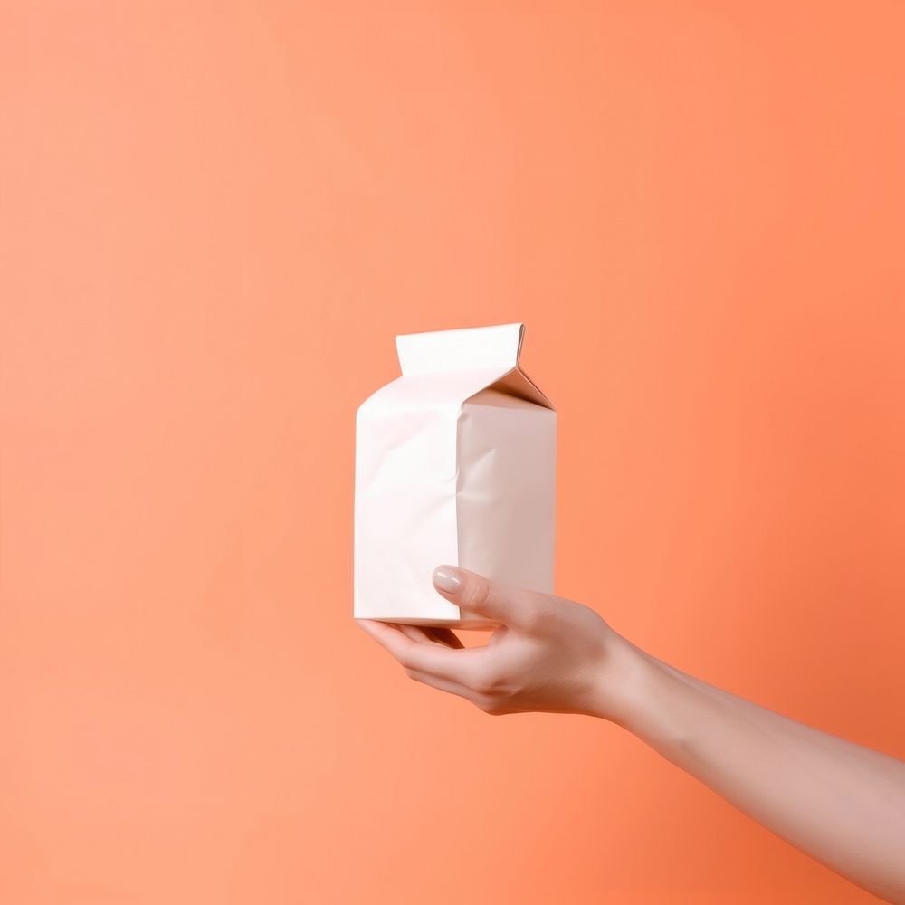 Food packaging holding paper hand.