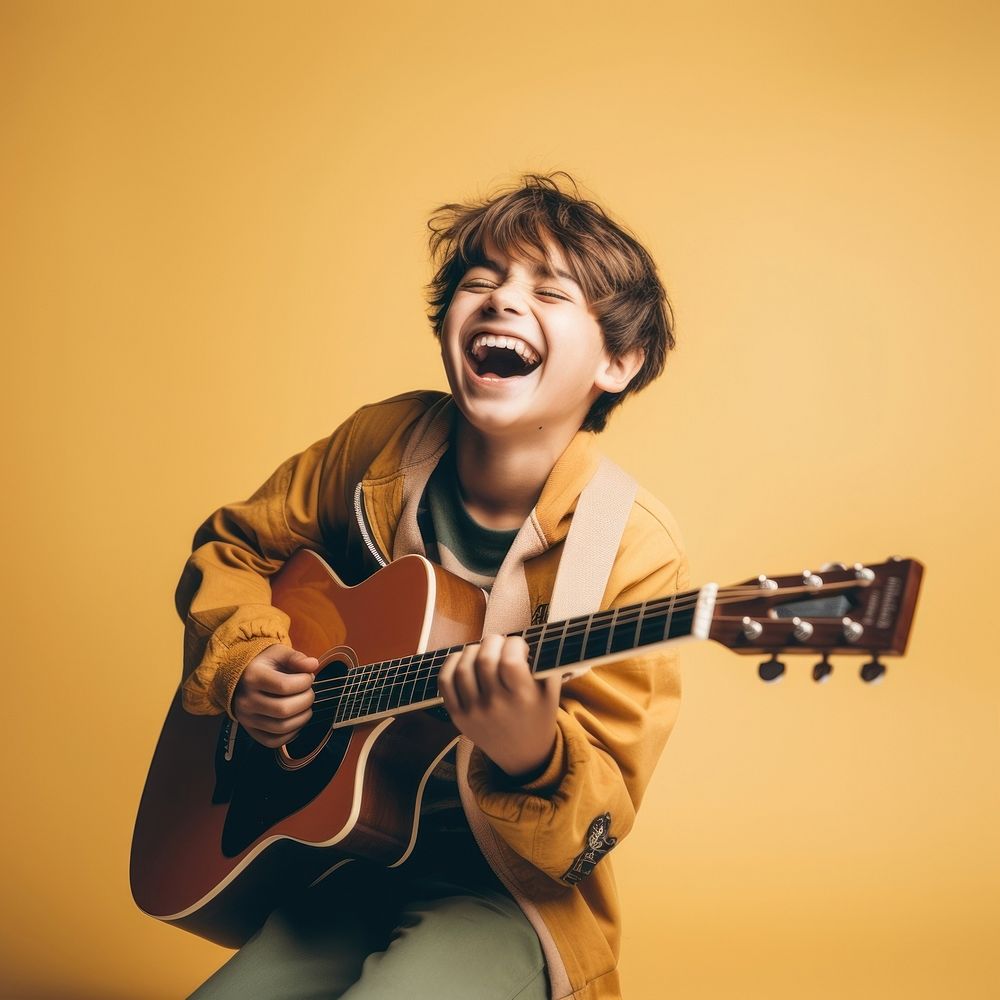 Boy play guitar musician portrait happy. AI generated Image by rawpixel.