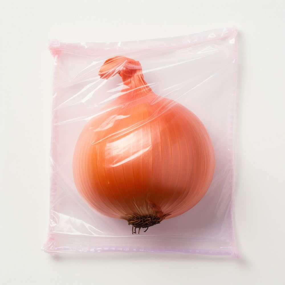 Plastic wrapping over a onion vegetable shallot food.