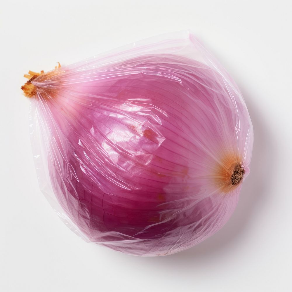Plastic wrapping over a onion vegetable shallot plant.