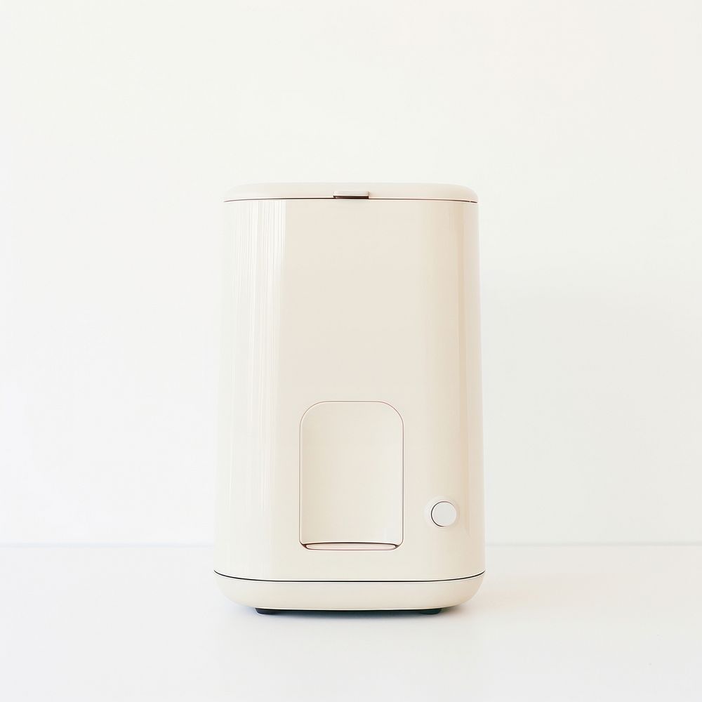 A minimal beige coffee maker white background technology appliance.