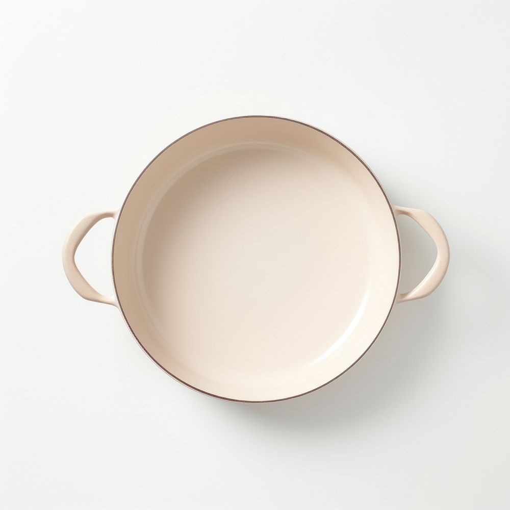 A beige ceramic pan bowl white background simplicity.