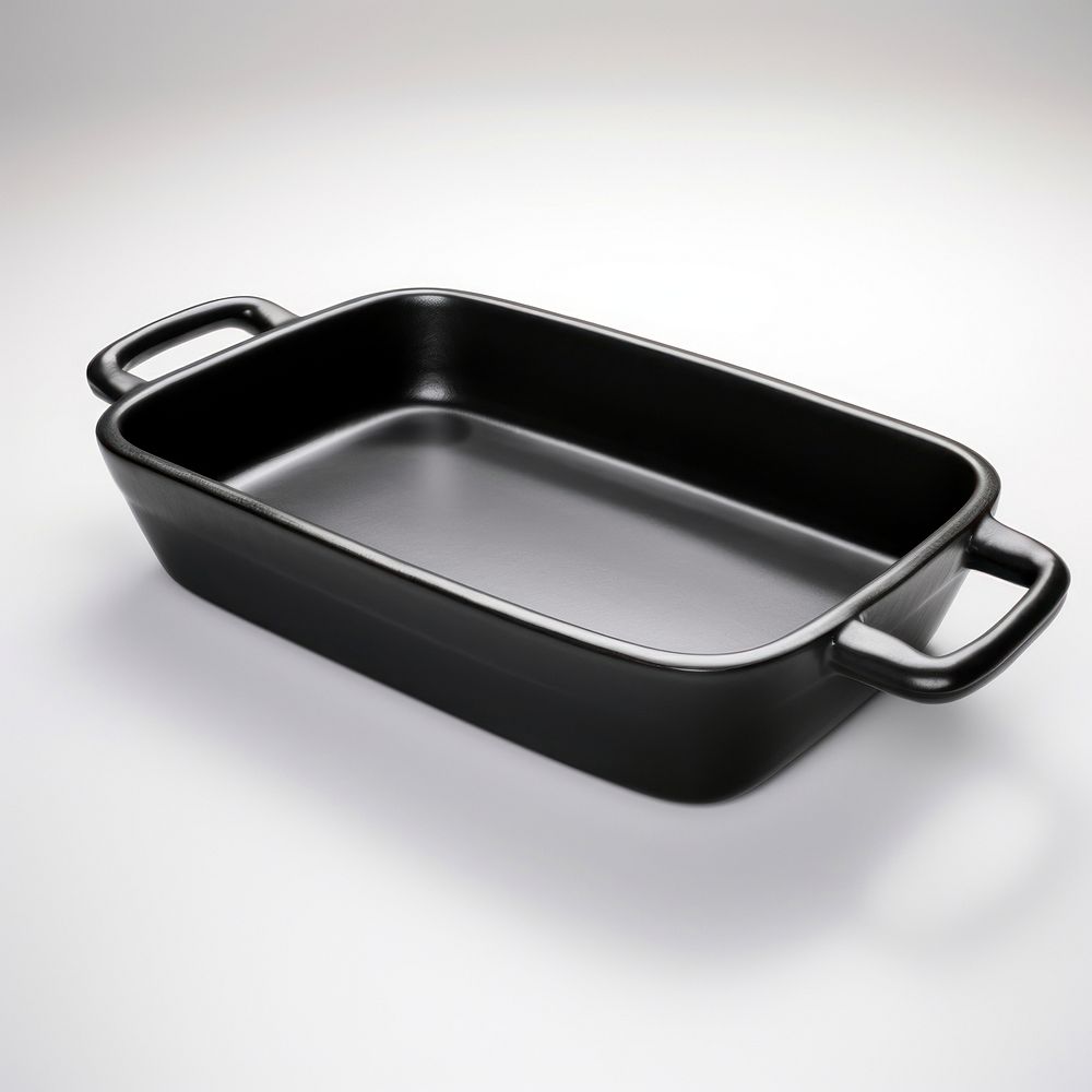 A black hot dish ceramic tray white background cookware.