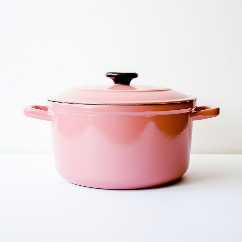 A retro pink dutch oven pot cookware white background appliance.