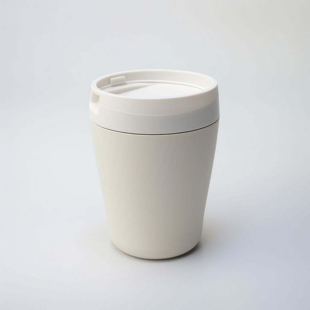 A white insulated tumbler with lid cup mug white background.