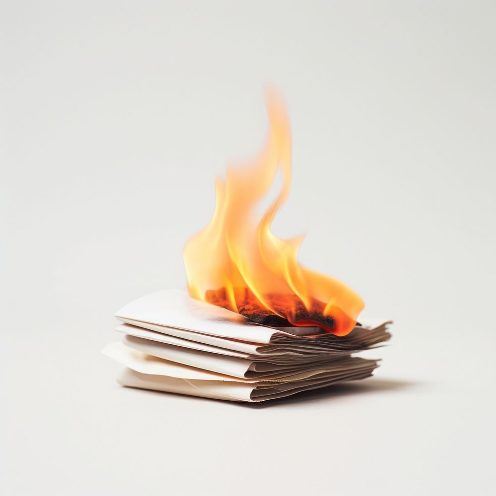 Photography of a Small Burning stack of paper fire burning flame.