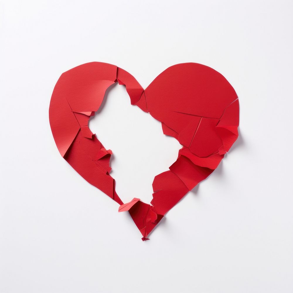 Red paper heart torn apart destruction misfortune breaking.