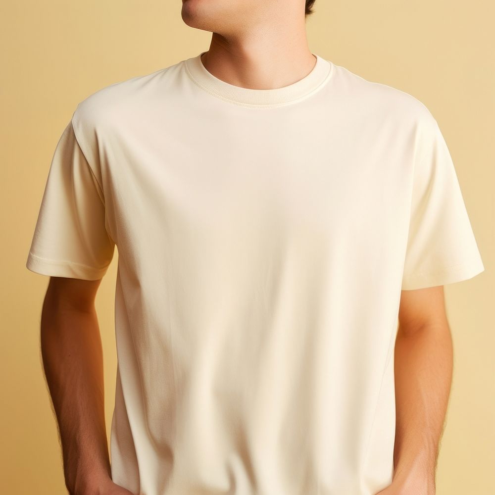 Men wear cream t shirt t-shirt sleeve midsection.